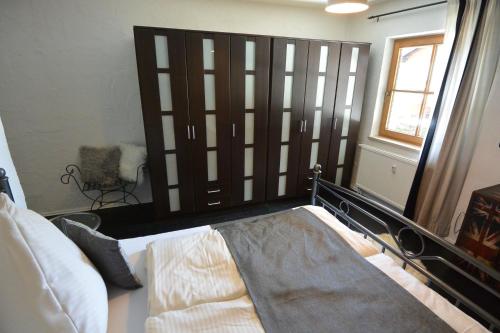 a bedroom with a bed and a large mirror at Alpenchalet Karwendel in Mittenwald