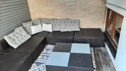 a couch sitting on top of a balcony at Alpenchalet Karwendel in Mittenwald