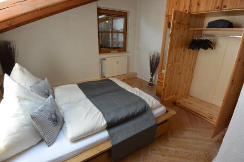 a bedroom with a large bed and a window at Alpenchalet Karwendel in Mittenwald