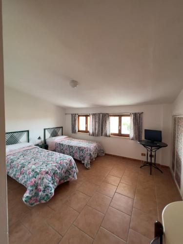 Postel nebo postele na pokoji v ubytování Albergo Ristorante Locanda Rosella