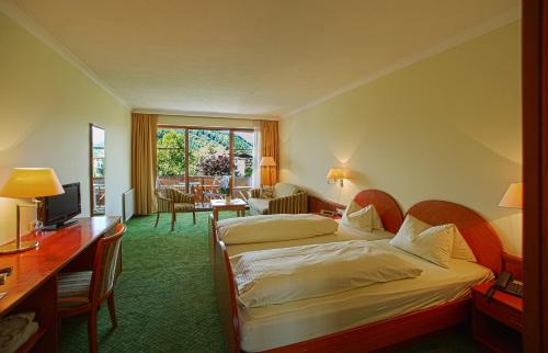 Postel nebo postele na pokoji v ubytování Hotel Birkenhof am See