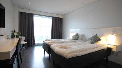 Tempat tidur dalam kamar di Forenom Aparthotel Gothenburg Nolvik