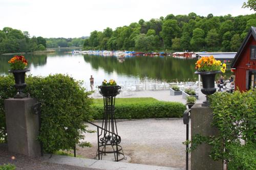 a view of a river with boats in the water at Stallmästaregården Hotel, Stockholm, a Member of Design Hotels in Stockholm