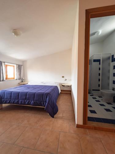 Postel nebo postele na pokoji v ubytování Albergo Ristorante Locanda Rosella