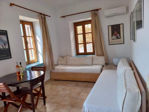 a living room with a couch and a table at Villa Amalia in Halki