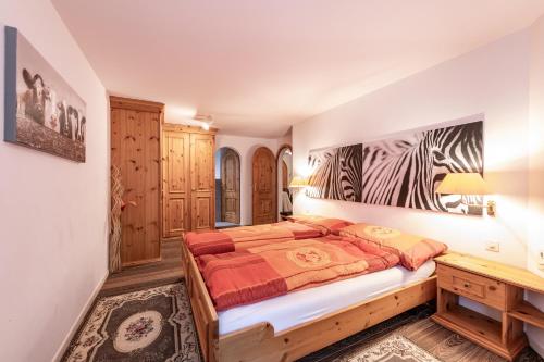 a bedroom with a bed and a desk at Chalet Belmont in Flims