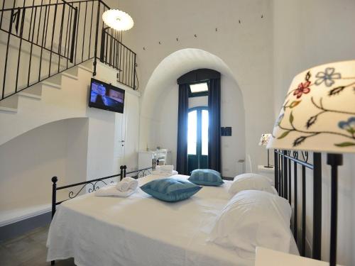 a bedroom with a bed with two pillows on it at Tenuta Orsanese in Ginosa Marina