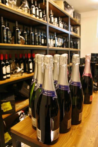 a row of wine bottles sitting on a table at Tenuta Orsanese in Ginosa Marina