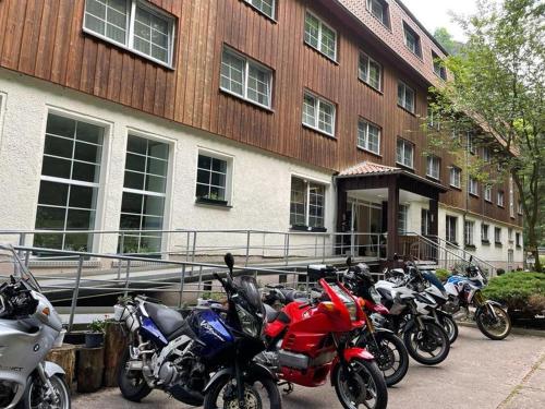 a group of motorcycles parked in front of a building at Waldhotel Harz Ilsenburg in Ilsenburg