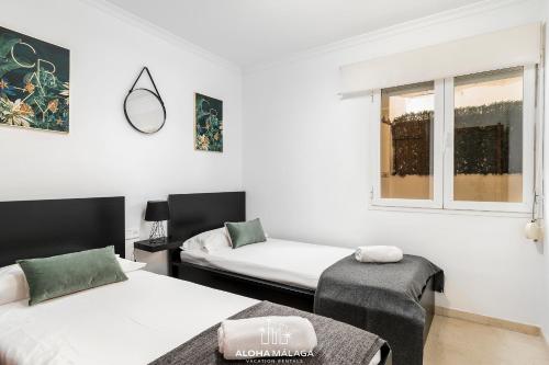 A bed or beds in a room at Wonderful Malaga Centro Apartment