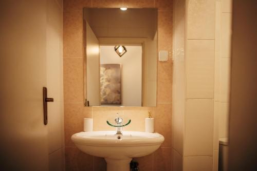 Ένα μπάνιο στο Laguna Green Guest House
