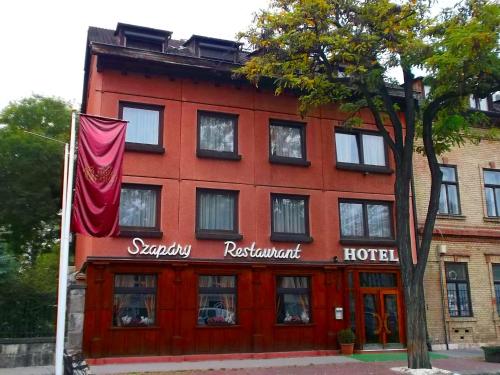 a red building with a hotel at Hotel Gloria Budapest City Center in Budapest