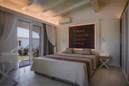 Ένα ή περισσότερα κρεβάτια σε δωμάτιο στο Limone Beach Resort