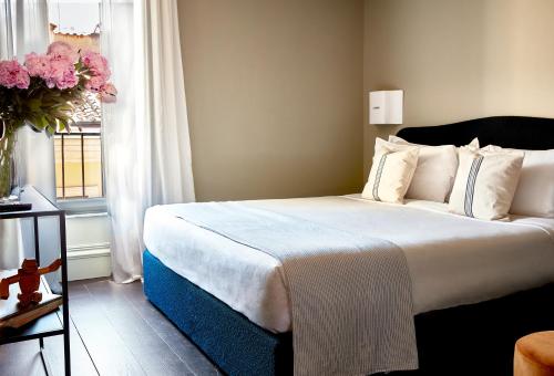 Ein Bett oder Betten in einem Zimmer der Unterkunft HOTEL VITE - By Naman Hotellerie