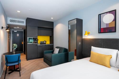 a hotel room with a bed and a kitchen at Staycity Aparthotels Dublin City Quay in Dublin
