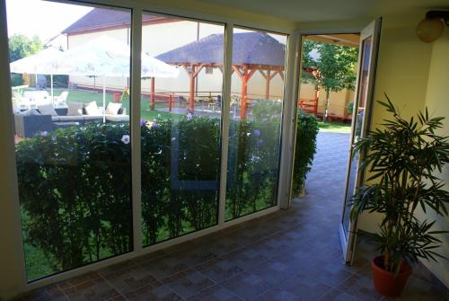 a sliding glass door with a view of a patio at Casa Ardeleneasca in Timişoara