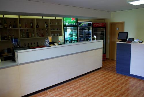 a bar at a restaurant with a counter at Casa Ardeleneasca in Timişoara
