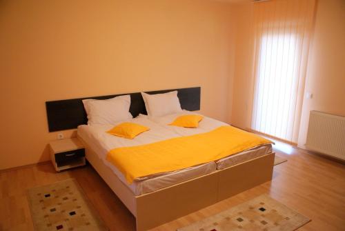 Кровать или кровати в номере Casa Ardeleneasca