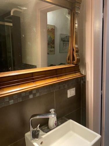 a bathroom with a sink and a mirror at Villa Gioia in Acqui Terme