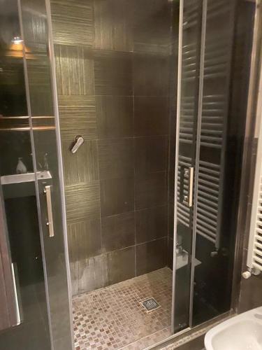 a shower with a glass door in a bathroom at Villa Gioia in Acqui Terme