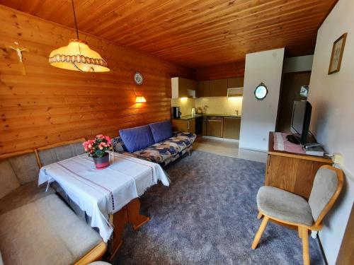 a living room with a couch and a table at Haus Bergblick in Spiss