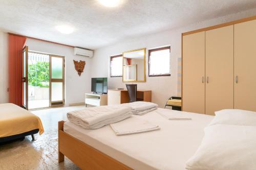 Postel nebo postele na pokoji v ubytování Apartment Milka