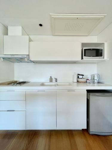 Una cocina o cocineta en Ilum Experience Home