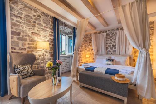 Postel nebo postele na pokoji v ubytování Boutique Hotel Capitano