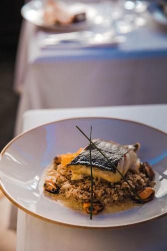 a plate with a piece of food on a table at Novotel Toulouse Centre Wilson in Toulouse