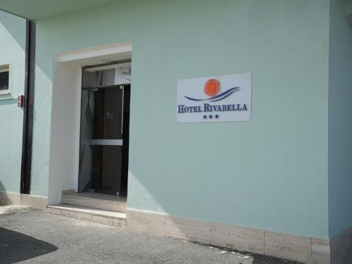 a sign on the side of a building at Hotel Rivabella in Davoli