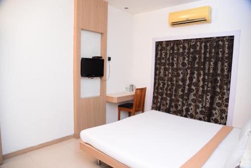 Katil atau katil-katil dalam bilik di Hotel Maharani