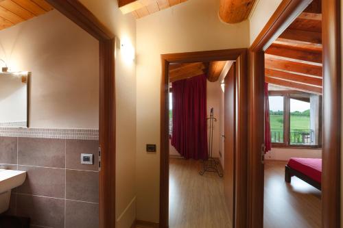 a bathroom with a sink and a toilet in a room at La Casa del Nonno in Monzambano