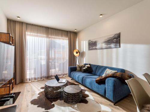 TV a/nebo společenská místnost v ubytování Apartment Liebelei am See - Traumblick aufs Kaisergebirge - nur ein Katzensprung zum See
