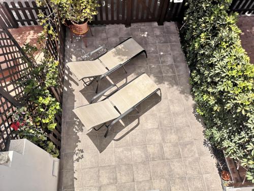 an overhead view of two tables and chairs on a patio at Maspalomas Casa La Loba in Maspalomas