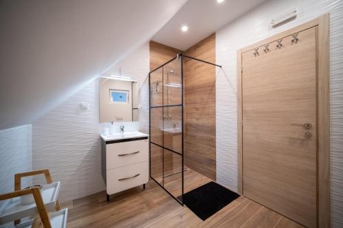 a bathroom with a shower and a sink at Villa Nesa - beautiful guest house at continental Croatia with Outdoor swimming pool, Sauna and 3 Bedrooms in Plaški