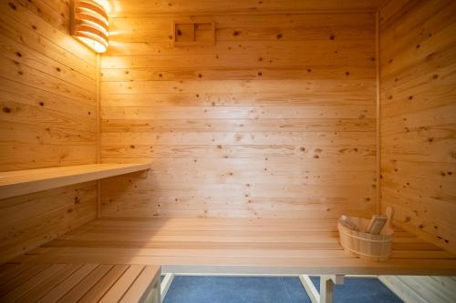 a wooden sauna with a bench in the middle at Villa Nesa - beautiful guest house at continental Croatia with Outdoor swimming pool, Sauna and 3 Bedrooms in Plaški