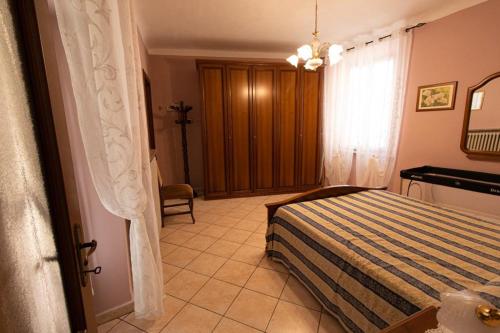 Кровать или кровати в номере La Casa del Postino