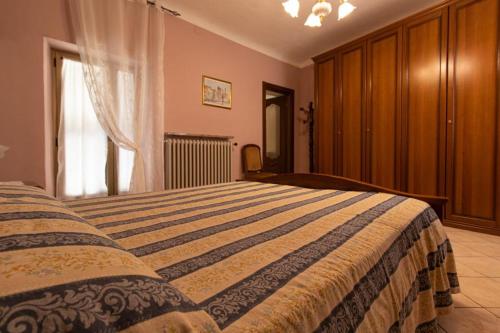 Кровать или кровати в номере La Casa del Postino
