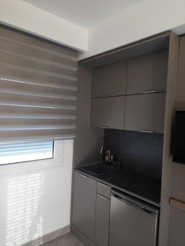 Dapur atau dapur kecil di SUN RESIDENCE Exclusive Seaside Suites