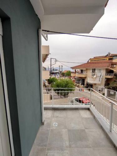 a view of a balcony from a building at Διαμέρισμα κοντά στην θάλασσα in Arkoudi
