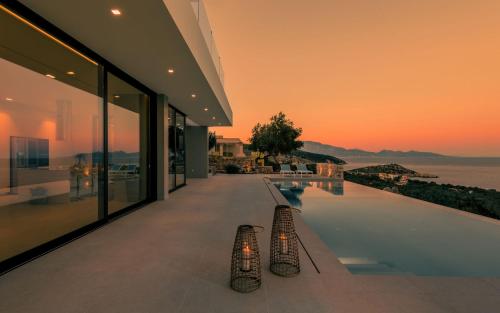 a view of a swimming pool in a house at The Sall Villa - Private pool and Breathtaking Views, by ZanteWize in Agios Nikolaos