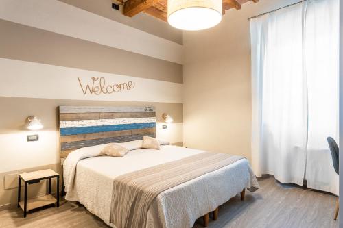 Postel nebo postele na pokoji v ubytování B&B Stella Lucca