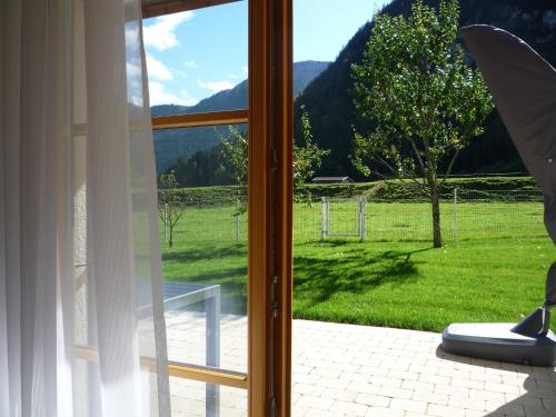 an open window with a view of a field at Ferienwohnung Aletsee in Pfronten