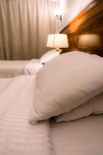 Ένα ή περισσότερα κρεβάτια σε δωμάτιο στο Hotel Royal Marshal