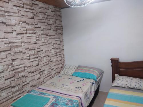 Ein Bett oder Betten in einem Zimmer der Unterkunft Casa Puerto Triunfo Dann