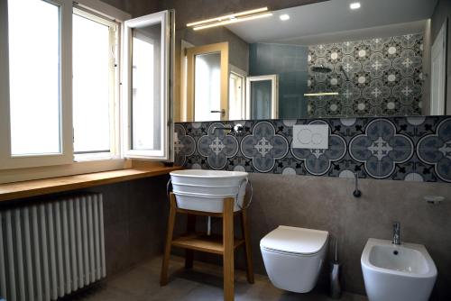 a bathroom with a sink and a toilet at Li Frati Suite in Lecce