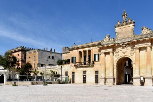 an old building with a cross on top of it at Li Frati Suite in Lecce