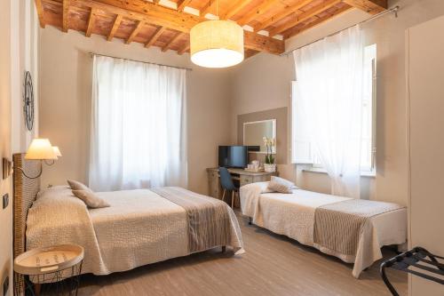 Postel nebo postele na pokoji v ubytování B&B Stella Lucca