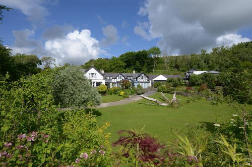 a large yard with houses in the background at Pentre Cerrig Country House in Llanferres