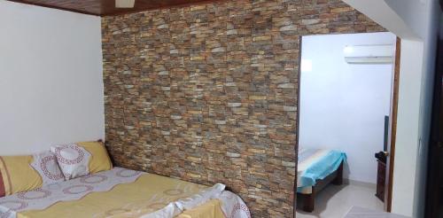 Ein Bett oder Betten in einem Zimmer der Unterkunft Casa Puerto Triunfo Dann
